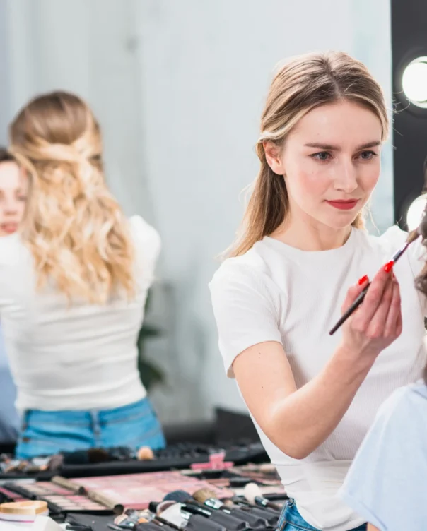 visagiste-creating-professional-makeup-woman-studio